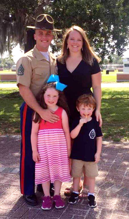 Marine Warrant Officer Arik Mauldin with his wife Erica and children Adalynn and Elliot.